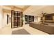 A spacious living room with a modern wine cellar and plenty of seating makes entertaining a breeze at 11 Tabby Ln, Isle of Palms, SC 29451