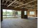 Spacious living room with waterfront view under construction, highlighting open layout and window placement at 11 Tabby Ln, Isle of Palms, SC 29451