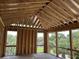 Unfinished patio featuring a framed roof, windows, and view of the neighborhood at 11 Tabby Ln, Isle of Palms, SC 29451