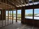 Bright open-concept living room under construction with ample natural light showcasing the space and window placement at 11 Tabby Ln, Isle of Palms, SC 29451