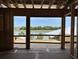 Waterfront view through the frame, with palm trees adding to the scenic beauty of the home's location at 11 Tabby Ln, Isle of Palms, SC 29451