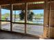 Stunning waterfront view framed by construction framing, highlighting the home's scenic location and design at 11 Tabby Ln, Isle of Palms, SC 29451