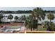 Aerial view featuring a pool under construction, palm trees, and a serene waterfront at 11 Tabby Ln, Isle of Palms, SC 29451