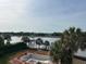 Breathtaking water view featuring an under-construction pool, palm trees, and a tranquil waterway at 11 Tabby Ln, Isle of Palms, SC 29451