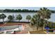Picturesque water view featuring an under-construction pool, palm trees, and calm waterway at 11 Tabby Ln, Isle of Palms, SC 29451