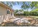 Backyard featuring a patio, exterior access door, mature landscaping, and a fenced perimeter at 1143 Winborn Dr, Charleston, SC 29412