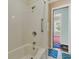 Basic bathroom features a white tub/shower combo and blue patterned floor mats at 1143 Winborn Dr, Charleston, SC 29412