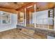 Cozy bonus room featuring wood paneling, brick accents, and backyard access at 1143 Winborn Dr, Charleston, SC 29412
