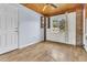 Bright bonus room with wood paneling, a ceiling fan, and a large window with backyard views at 1143 Winborn Dr, Charleston, SC 29412