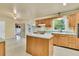 Kitchen with wood cabinets, center island, and adjacent breakfast area with natural light at 1143 Winborn Dr, Charleston, SC 29412