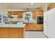 Traditional kitchen with wood cabinets, island, and modern appliances at 1143 Winborn Dr, Charleston, SC 29412