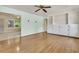 Bright living room featuring hardwood floors, neutral paint, and built-in cabinets and shelving at 1143 Winborn Dr, Charleston, SC 29412