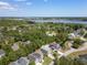 Scenic aerial view showcasing a neighborhood with lush greenery and waterfront views at 118 Wando Reach Rd, Wando, SC 29492