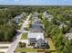 An aerial view of a home with a porch and fenced-in backyard in a wooded neighborhood at 118 Wando Reach Rd, Wando, SC 29492