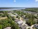 Beautiful aerial of a coastal neighborhood with houses and pond and trees at 118 Wando Reach Rd, Wando, SC 29492