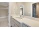 This bathroom features a white vanity with sink, mirror, and views to the bedroom and shower at 118 Wando Reach Rd, Wando, SC 29492
