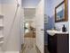 A bathroom doorway leads into a living area, with a sink and walk-in shower on display at 118 Wando Reach Rd, Wando, SC 29492