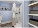 Charming bathroom featuring a shower, floating shelves and blue painted walls at 118 Wando Reach Rd, Wando, SC 29492