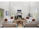 Open living room featuring high ceilings, white walls and large windows at 118 Wando Reach Rd, Wando, SC 29492
