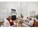 Cozy living room with fireplace, high ceiling and hardwood floors at 118 Wando Reach Rd, Wando, SC 29492