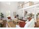 Bright, open-concept living room features hardwood floors and soaring ceilings at 118 Wando Reach Rd, Wando, SC 29492
