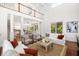 Open-concept living room connected to the kitchen with a vaulted ceiling and hardwood floors at 118 Wando Reach Rd, Wando, SC 29492