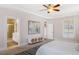 Relaxing main bedroom with ensuite bathroom, neutral tones, and bright natural light through several windows at 118 Wando Reach Rd, Wando, SC 29492