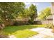 Backyard featuring a wood fence, a patio, and a well-maintained lawn at 120 Full Moon Ct, Ladson, SC 29456