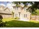 Backyard features green grass, flowers, trees, and a patio area for outdoor living at 120 Full Moon Ct, Ladson, SC 29456