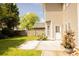 Backyard features a green lawn, wood fence, bushes, and a concrete patio at 120 Full Moon Ct, Ladson, SC 29456