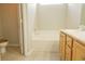 Bathroom with tiled floor, bath and sink with wooden vanity at 120 Full Moon Ct, Ladson, SC 29456