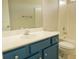 Bathroom featuring a blue vanity with white countertop, toilet, and shower at 120 Full Moon Ct, Ladson, SC 29456