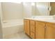 Bathroom with a double sink vanity and large soaking tub at 120 Full Moon Ct, Ladson, SC 29456