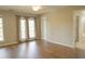 Spacious bedroom with wood flooring and large windows at 120 Full Moon Ct, Ladson, SC 29456