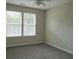 Bedroom featuring large windows and neutral colored carpet at 120 Full Moon Ct, Ladson, SC 29456
