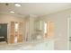 Open-concept kitchen featuring granite counters, light green cabinetry, and access to adjacent living space at 120 Full Moon Ct, Ladson, SC 29456