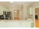 Charming kitchen features stone countertops, modern appliances, and light green cabinetry at 120 Full Moon Ct, Ladson, SC 29456
