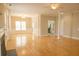 Open living room with hardwood, fireplace and kitchen access creates inviting flow, lots of natural light at 120 Full Moon Ct, Ladson, SC 29456