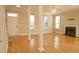 Bright living room with hardwood floors, fireplace and abundant natural light at 120 Full Moon Ct, Ladson, SC 29456