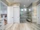 Spacious bathroom featuring a glass-enclosed shower, marble flooring, and modern fixtures at 124 Charleston Blvd, Isle of Palms, SC 29451