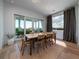Dining room with a large table, natural light, and sliding glass doors leading to an outdoor patio at 124 Charleston Blvd, Isle of Palms, SC 29451