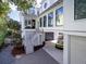 Beautiful modern house with a connected garage and manicured landscaping at 124 Charleston Blvd, Isle of Palms, SC 29451