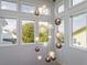 A foyer featuring a unique hanging ball chandelier and bright natural light at 124 Charleston Blvd, Isle of Palms, SC 29451