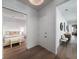 Bright hallway leading to a bedroom featuring hardwood floors and elegant decor throughout at 124 Charleston Blvd, Isle of Palms, SC 29451
