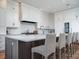 Bright and open kitchen with white cabinets, a large island, and stainless-steel appliances at 124 Charleston Blvd, Isle of Palms, SC 29451