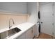 Bright laundry room with modern appliances, sleek countertops, and ample storage space at 124 Charleston Blvd, Isle of Palms, SC 29451