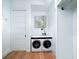 Modern laundry room with washer and dryer, and ample storage space at 124 Charleston Blvd, Isle of Palms, SC 29451