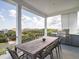 Outdoor patio featuring a dining table, seating, and grill, with beautiful views of the neighborhood at 124 Charleston Blvd, Isle of Palms, SC 29451