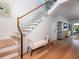 Elegant staircase with wood treads, glass railings, and ample natural light at 124 Charleston Blvd, Isle of Palms, SC 29451