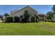 Wide view of the property's backyard featuring a stone patio with pergola and a storage shed at 124 Corral Cir, Summerville, SC 29485